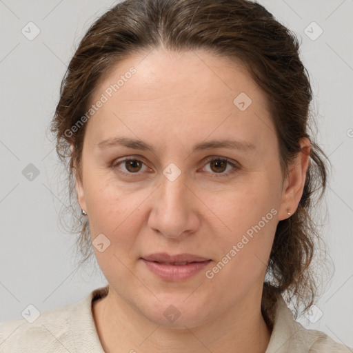 Joyful white adult female with medium  brown hair and grey eyes