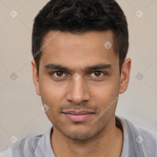 Joyful white young-adult male with short  black hair and brown eyes