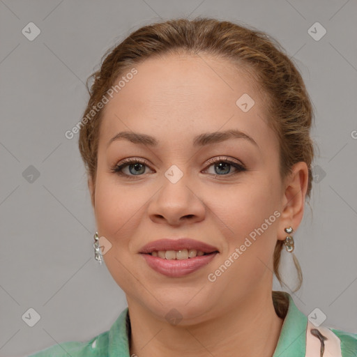 Joyful white young-adult female with medium  brown hair and grey eyes