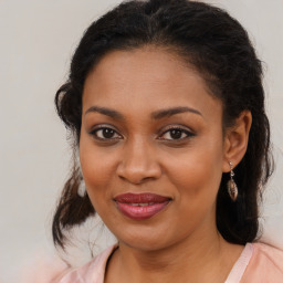 Joyful black young-adult female with medium  brown hair and brown eyes