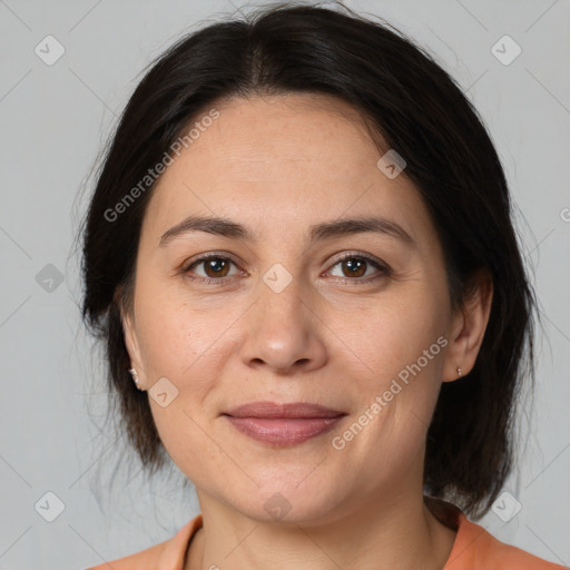 Joyful white adult female with medium  brown hair and brown eyes