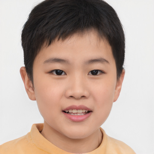 Joyful asian child male with short  brown hair and brown eyes
