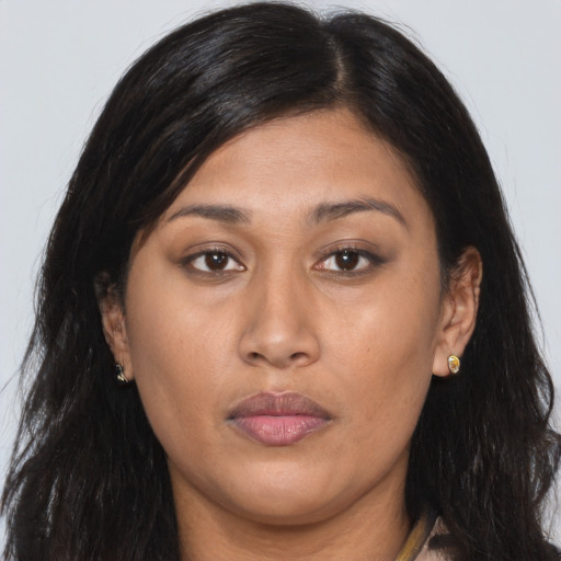 Joyful asian young-adult female with long  brown hair and brown eyes
