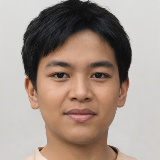 Joyful asian young-adult male with short  black hair and brown eyes