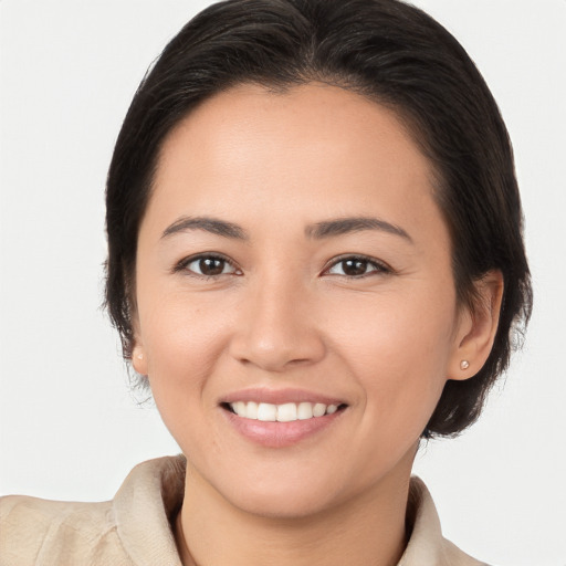 Joyful white young-adult female with medium  brown hair and brown eyes