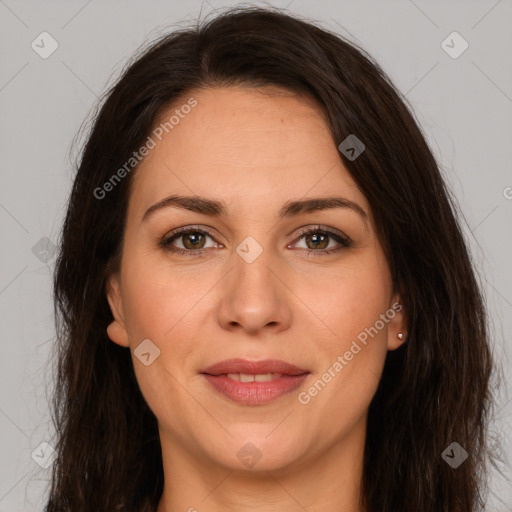 Joyful white adult female with long  brown hair and brown eyes