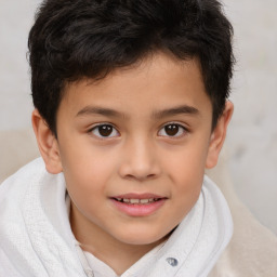 Joyful white child male with short  brown hair and brown eyes