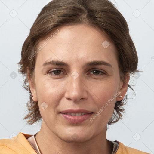 Joyful white adult female with medium  brown hair and brown eyes