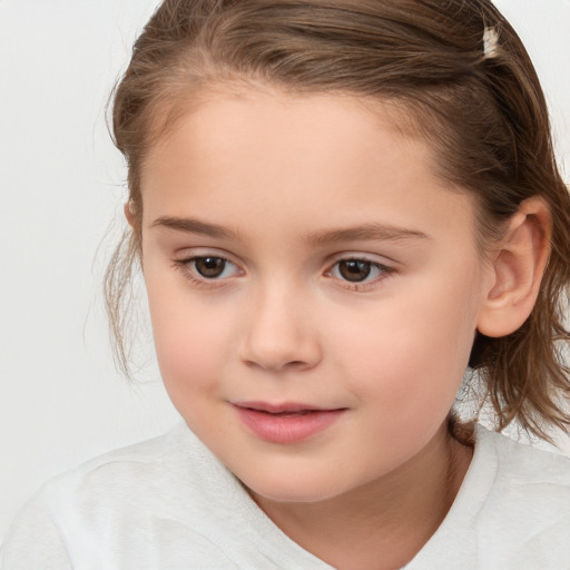 Joyful white child female with medium  brown hair and brown eyes