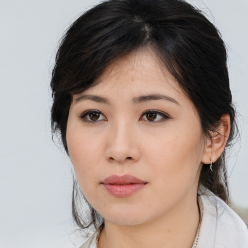 Neutral asian young-adult female with medium  brown hair and brown eyes