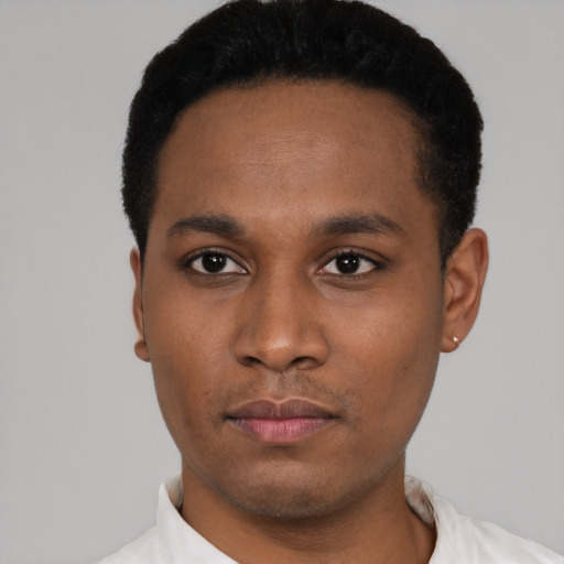 Neutral latino young-adult male with short  black hair and brown eyes