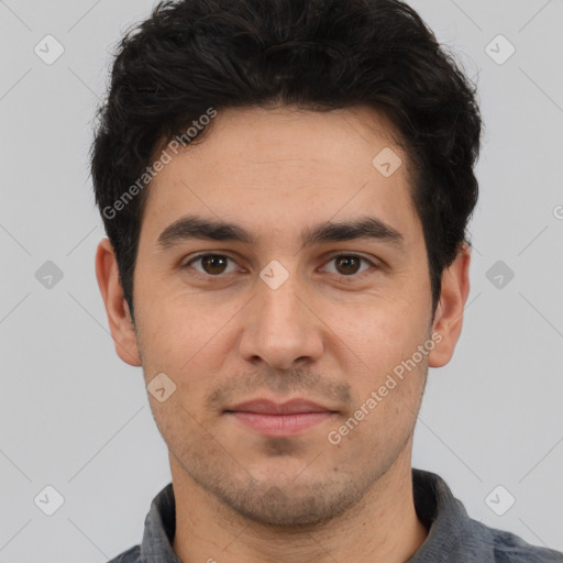 Joyful white young-adult male with short  black hair and brown eyes