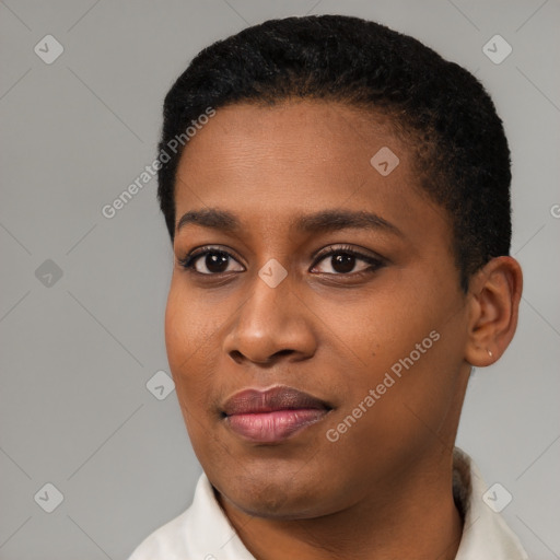 Joyful black young-adult female with short  black hair and brown eyes