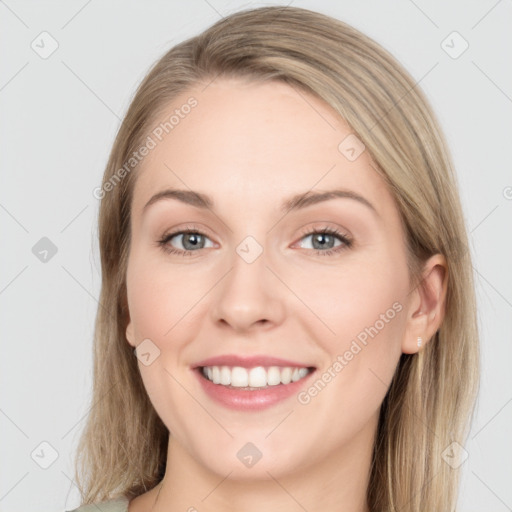 Joyful white young-adult female with long  brown hair and green eyes