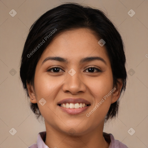 Joyful latino young-adult female with medium  brown hair and brown eyes