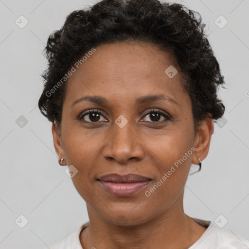 Joyful black adult female with short  brown hair and brown eyes