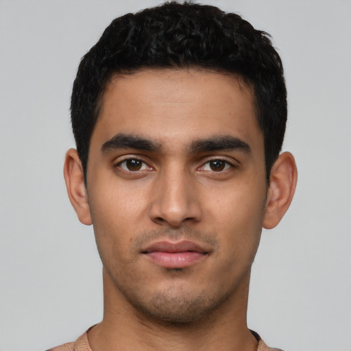 Neutral latino young-adult male with short  black hair and brown eyes