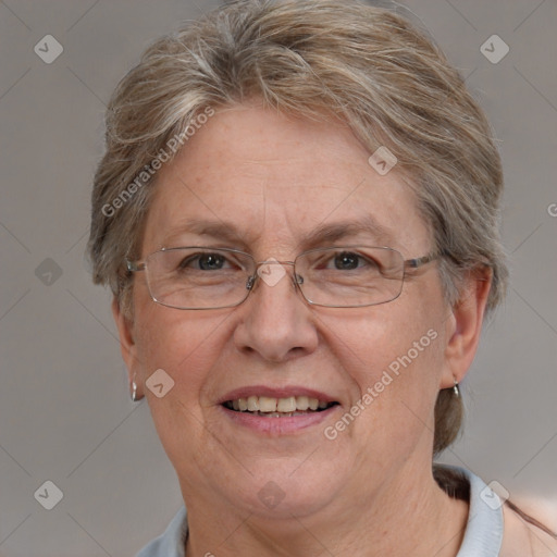 Joyful white middle-aged female with short  brown hair and blue eyes