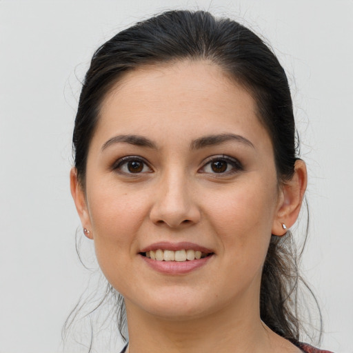 Joyful white young-adult female with medium  brown hair and brown eyes