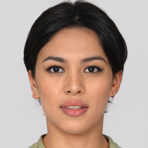 Joyful asian young-adult female with medium  black hair and brown eyes