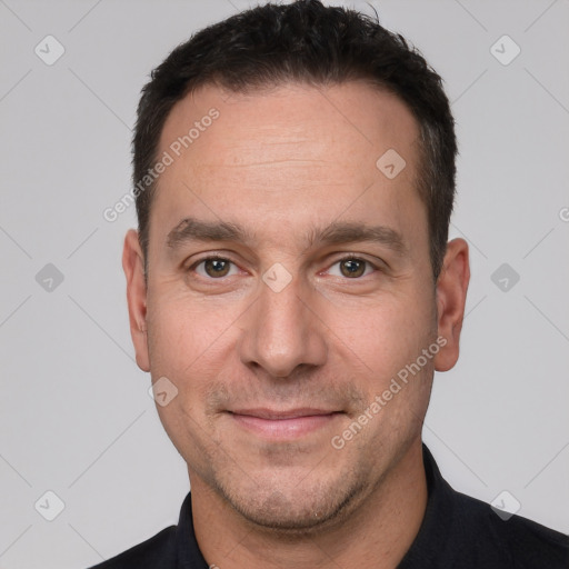 Joyful white adult male with short  brown hair and brown eyes