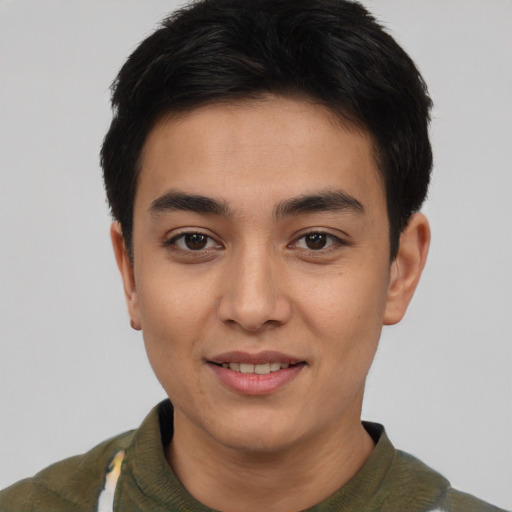 Joyful asian young-adult male with short  black hair and brown eyes