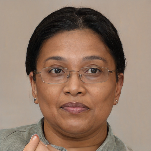 Joyful asian adult female with short  brown hair and brown eyes