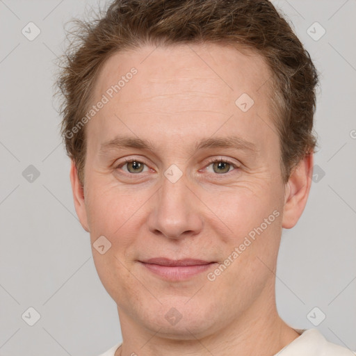 Joyful white adult male with short  brown hair and grey eyes