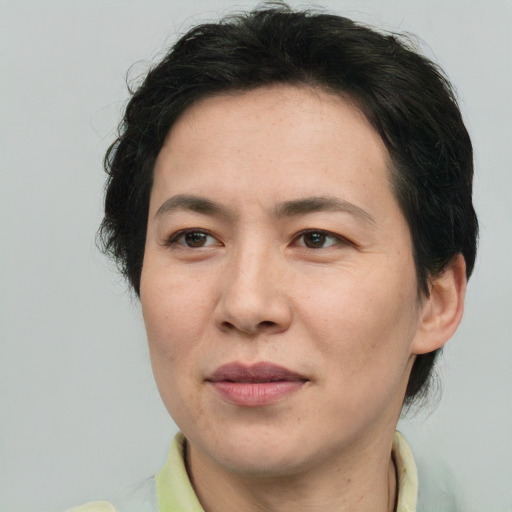 Joyful white adult female with short  brown hair and brown eyes