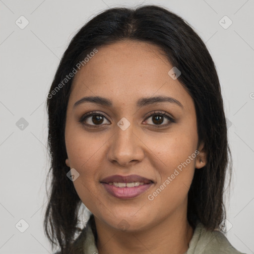 Joyful latino young-adult female with long  brown hair and brown eyes