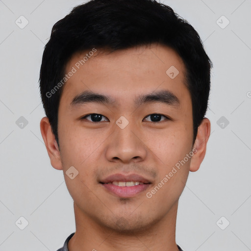 Joyful asian young-adult male with short  black hair and brown eyes