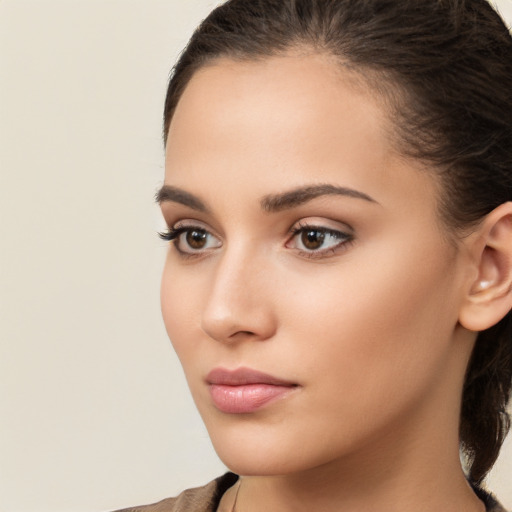 Neutral white young-adult female with long  brown hair and brown eyes