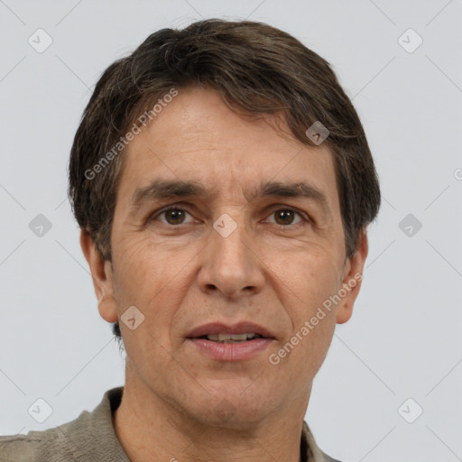 Joyful white adult male with short  brown hair and brown eyes