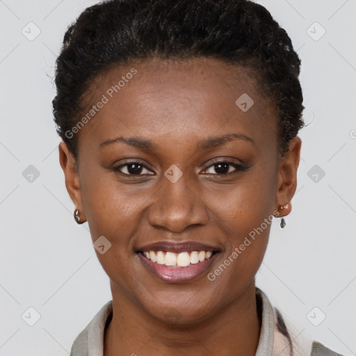 Joyful black young-adult female with short  brown hair and brown eyes