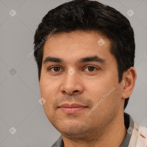 Joyful white young-adult male with short  black hair and brown eyes