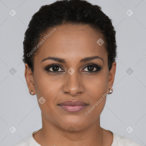 Joyful black young-adult female with short  brown hair and brown eyes