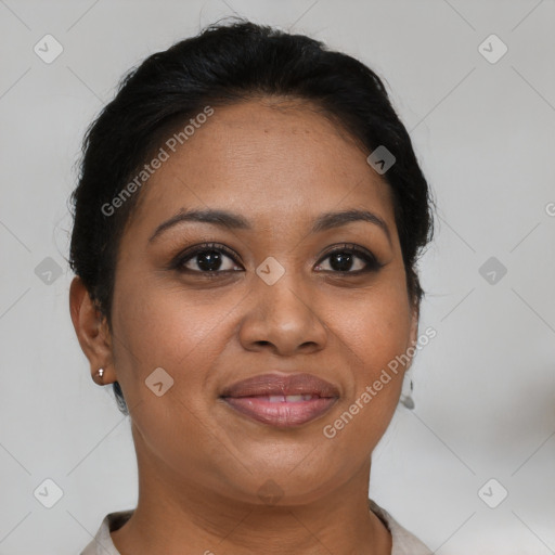 Joyful black adult female with short  brown hair and brown eyes