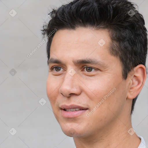 Joyful white young-adult male with short  black hair and brown eyes