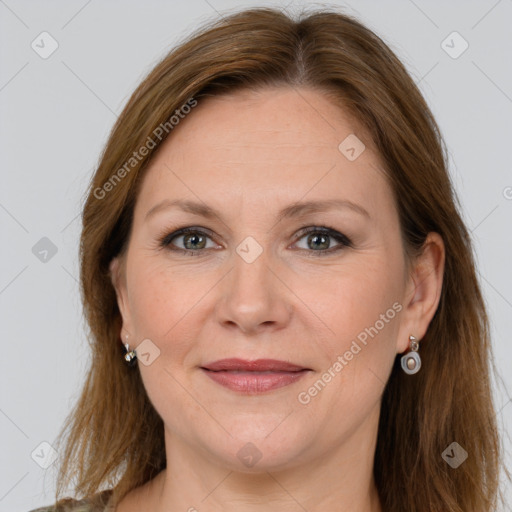 Joyful white adult female with long  brown hair and grey eyes