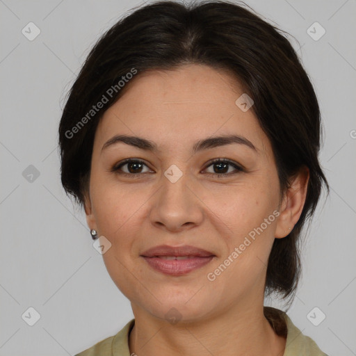 Joyful asian adult female with medium  brown hair and brown eyes