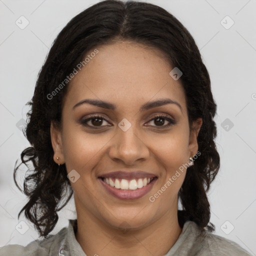 Joyful black young-adult female with long  brown hair and brown eyes