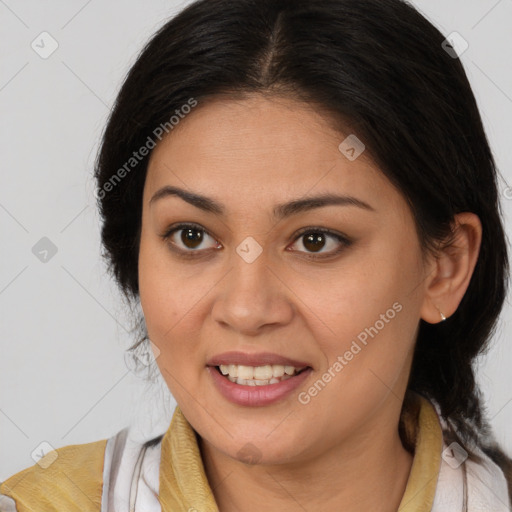 Joyful latino young-adult female with medium  brown hair and brown eyes