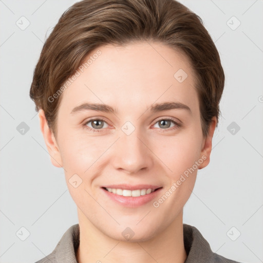 Joyful white young-adult female with short  brown hair and grey eyes