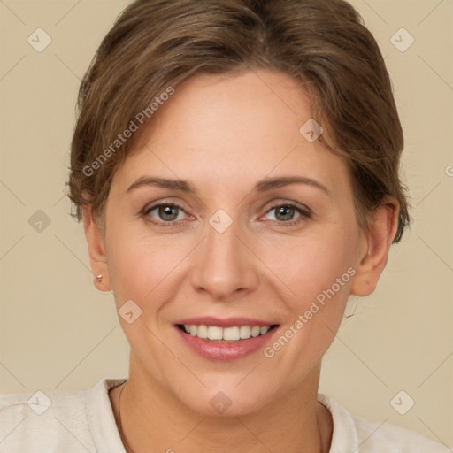 Joyful white adult female with short  brown hair and brown eyes