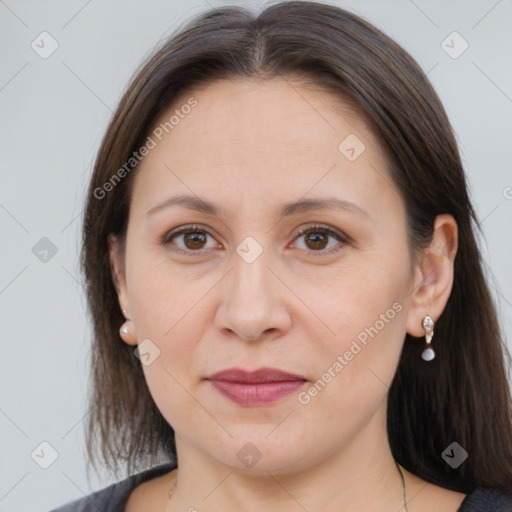 Joyful white adult female with long  brown hair and brown eyes