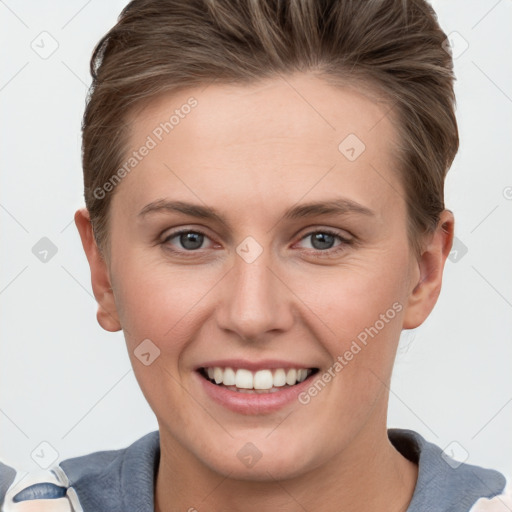 Joyful white young-adult female with short  brown hair and grey eyes