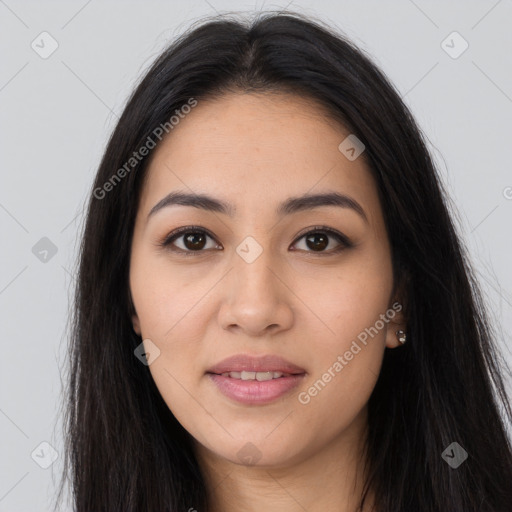 Joyful latino young-adult female with long  brown hair and brown eyes