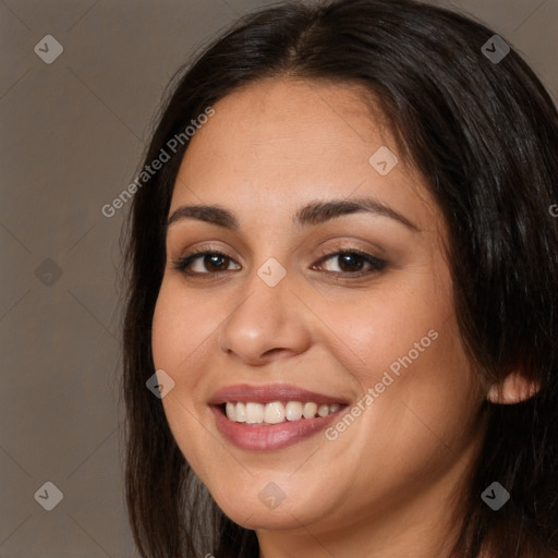 Joyful white young-adult female with long  brown hair and brown eyes