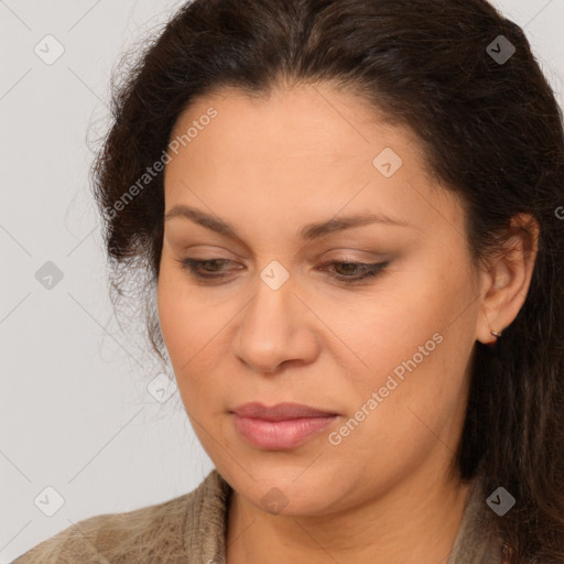 Joyful white adult female with long  brown hair and brown eyes