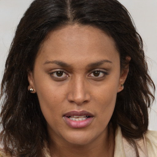 Joyful white young-adult female with long  brown hair and brown eyes